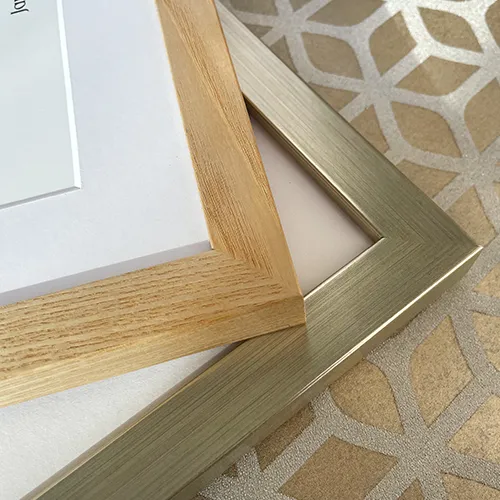 Corner detail of natural wood and antique gold framed Celtic Irish prints